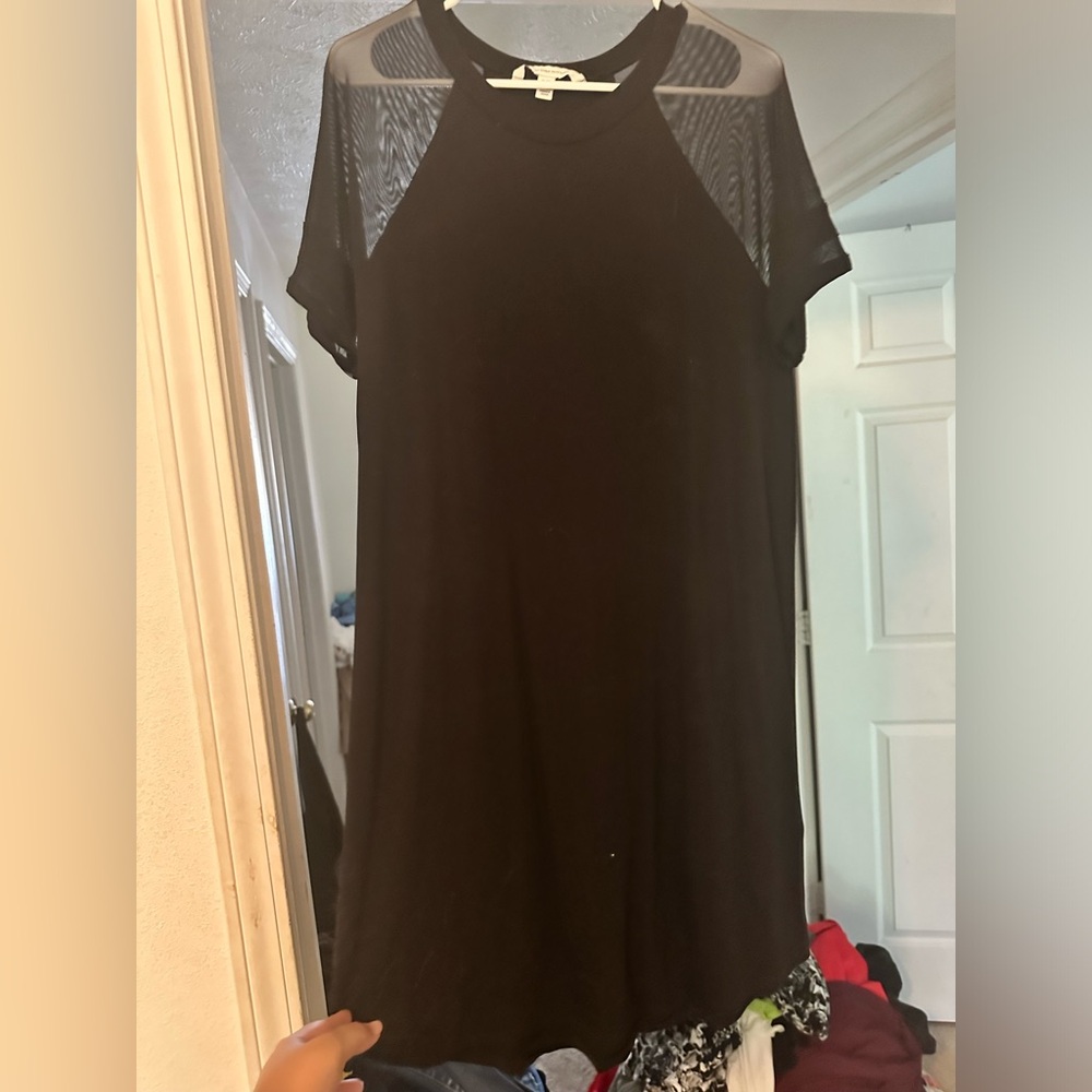 Little black dress with jersey knit material and mesh shoulder details
